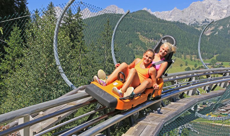 Two kids on the summer toboggan run Rittersberg | © Erlebnis Rittisberg