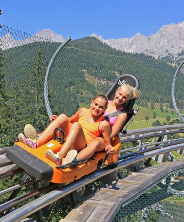 Two kids on the summer toboggan run Rittersberg | © Erlebnis Rittisberg