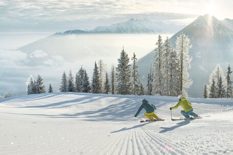 Skiers on the piste on Hochwurzen