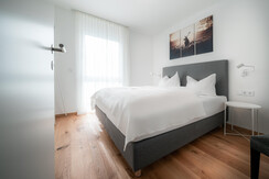 Master bedroom with box spring bed