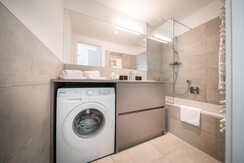 Bathroom with bathtub and integrated shower