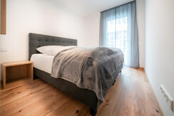 Second bedroom with comfortable box spring bed