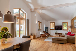 Generous living room with panorama glass front