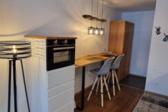 Kitchen with oven and bar