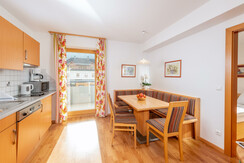 Dining table and access to the balcony