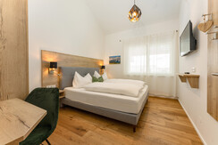 Bedroom 1 with double bed and TV