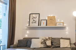 Cozy sofa and access to the balcony